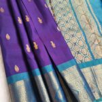 Royal Purple Silk Saree with Aqua Blue Zari Border and Peacock Motifs