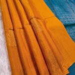 Elegant Orange Silk Saree with Rich Blue Pallu and Intricate Border