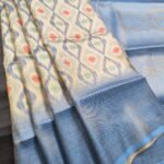 Sky Coloured Fancy Silk Saree with Ikat Motifs and Elegant Zari Border