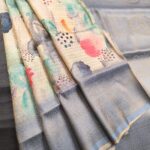 Pastel Coloured Fancy Silk Saree with Artistic Motifs and Elegant Zari Border