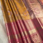 Golden Coloured Tissue Saree with Floral Motifs and Rich Zari Border