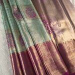 Elegant Gold and Sea Green Tissue Saree with Paisley Motifs and Rich Zari Border
