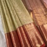 Golden Coloured Tissue Saree with Intricate Motifs and Rich Zari Border