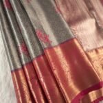 Silver Coloured Tissue Saree with Floral Motifs and Rich Zari Pallu