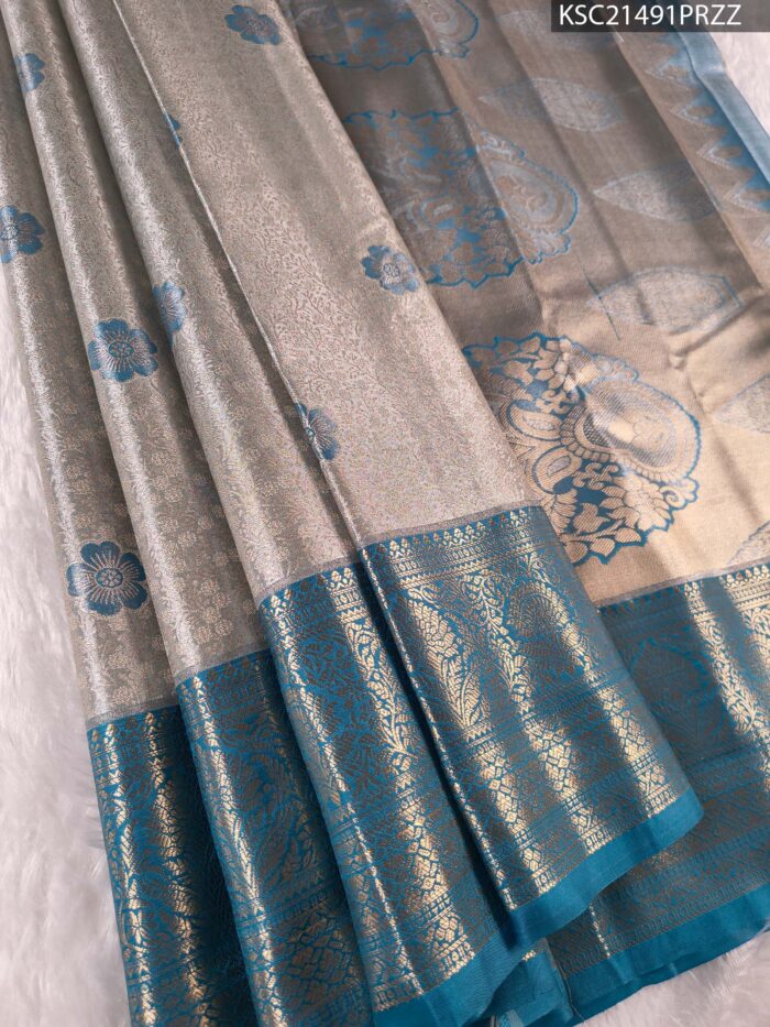 Silver and Teal Tissue Saree with Floral Motifs and Rich Zari Border - Image 1