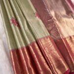 Pastel Green Tissue Saree with Floral Motifs and Rich Zari Woven Border