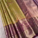Olive Green Coloured Tissue Saree with Rich Zari Floral Motifs and Contrast Purple Border