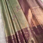 Green and Purple Tissue Saree with Rich Floral Motifs and Intricate Zari Border