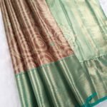 Green and Brown Tissue Saree with Paisley Motifs and Rich Zari Border