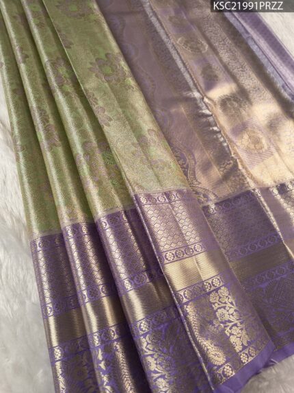 Green and Lavender Tissue Saree with Floral Motifs and Rich Zari Border