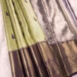 Green and Silver Tissue Saree with Paisley Motifs and Rich Zari Border