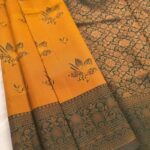 Golden Yellow Fancy Saree with Green Border and Intricate Motifs