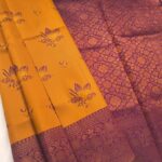 Golden and Maroon Semi Soft Silk Fancy Saree with Floral Motifs and Intricate Border