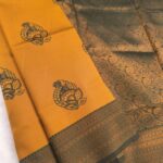 Golden and Green Semi Soft Silk Fancy Saree with Traditional Motifs and Elegant Border