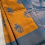 Mustard Yellow and Blue Fancy Saree with Traditional Fish Motifs and Intricate Border