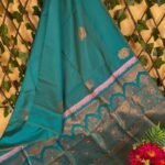 Teal Semi Soft Silk Saree with Intricate Golden Motifs and Pink Border