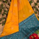 Vibrant Yellow Semi Soft Silk Saree with Teal Pallu and Intricate Border Design