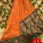 Rust Orange Semi Soft Silk Saree with Rich Green Floral Border